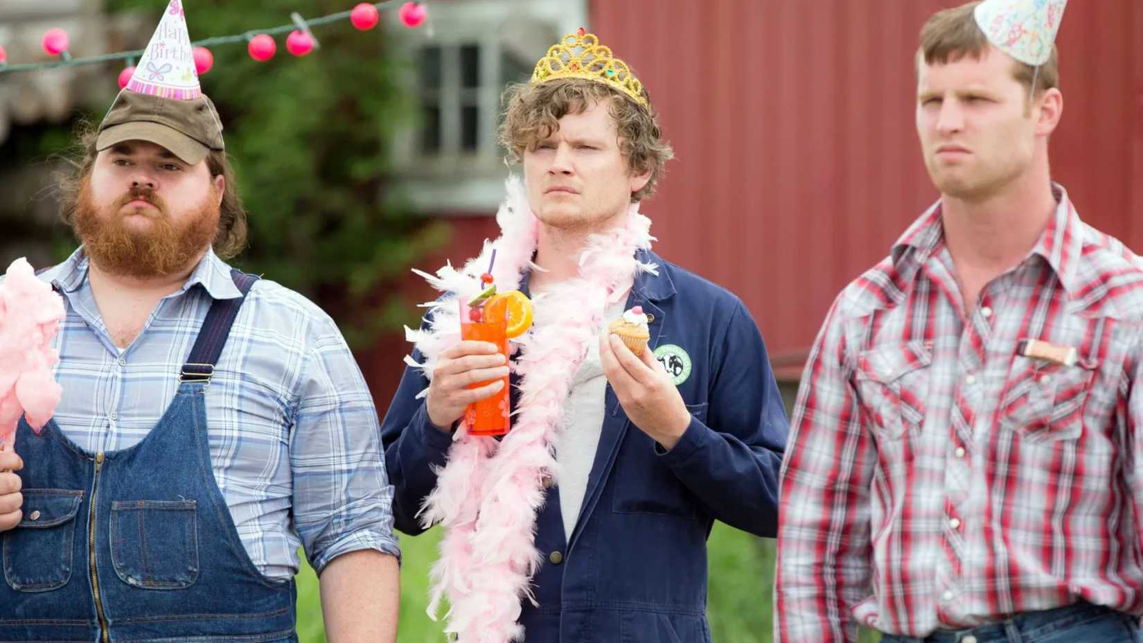wayne and friends looking at someone off screen at a birthday party in letterkenny