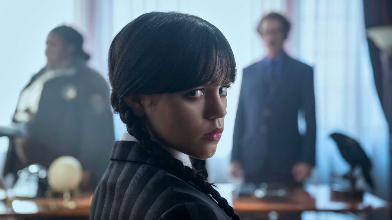 Jenna Ortega looking over her shoulder as Wednesday Addams in Wednesday season 2