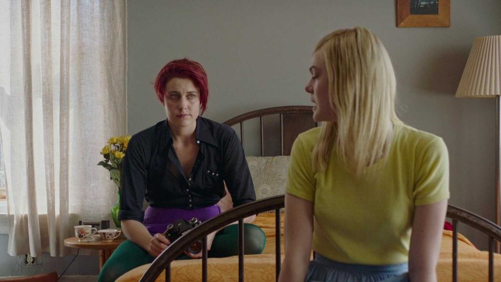 Greta Gerwig talks to Elle Fanning on a bed in 20th Century Women