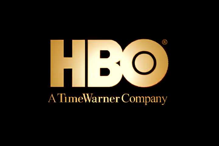 A golden HBO Time Warner logo on a black background