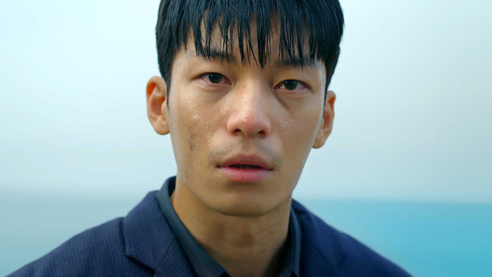 Netflix Has 1 More Chance To Redeem Its Stranger Things Replacement 1 A man stares blankly while standing at the edge of a cliff in Squid Game.