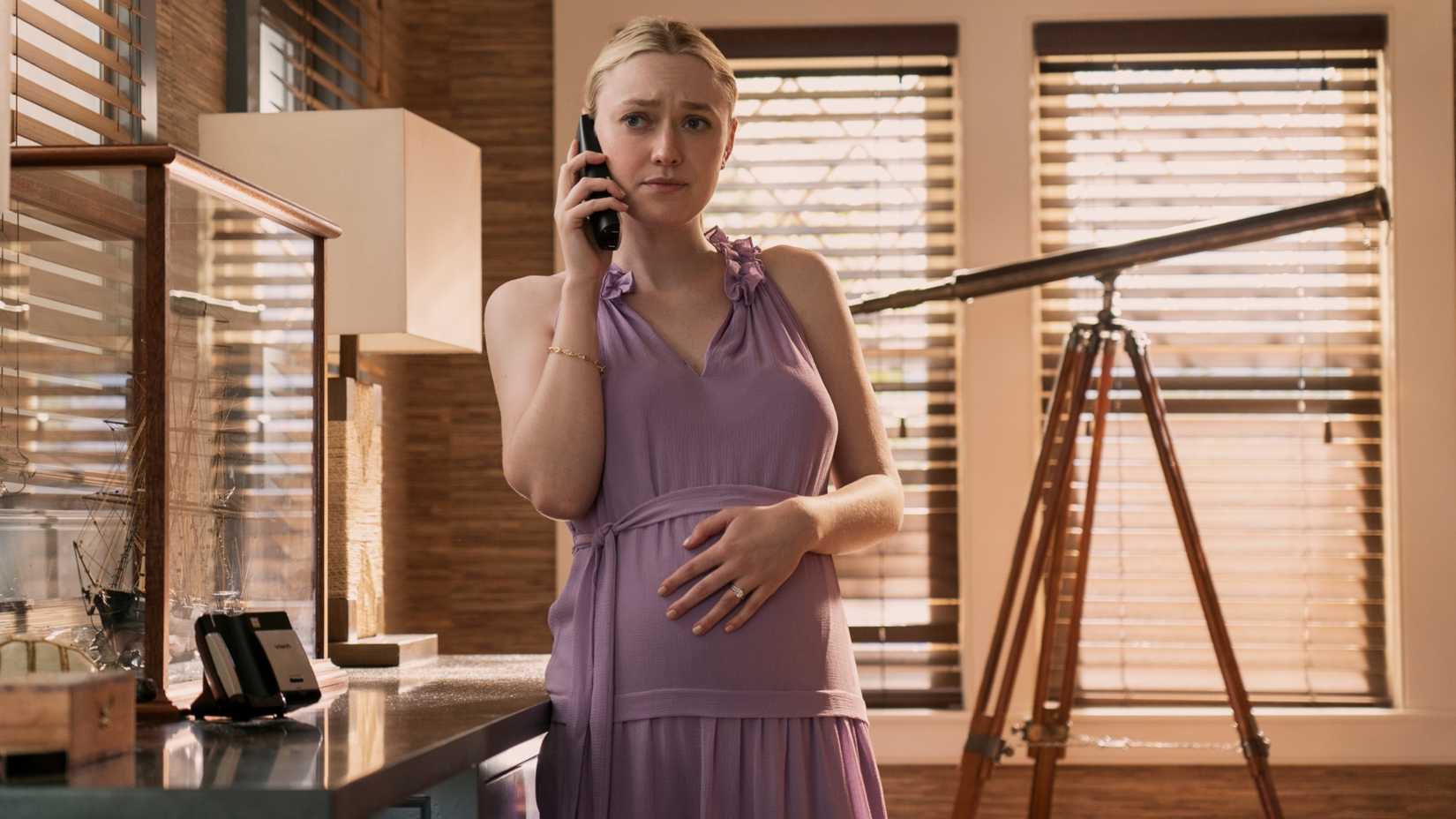 Abby Winbury (Dakota Fanning) on the phone looking stressed in The Perfect Couple