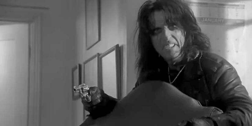 Alice Cooper brandishing a gun in Monk