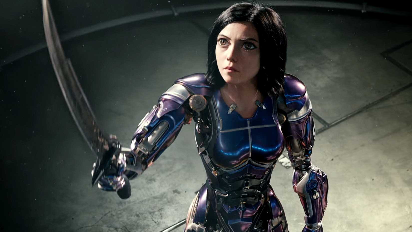 Alita raises her sword in Battle Angel's ending scene