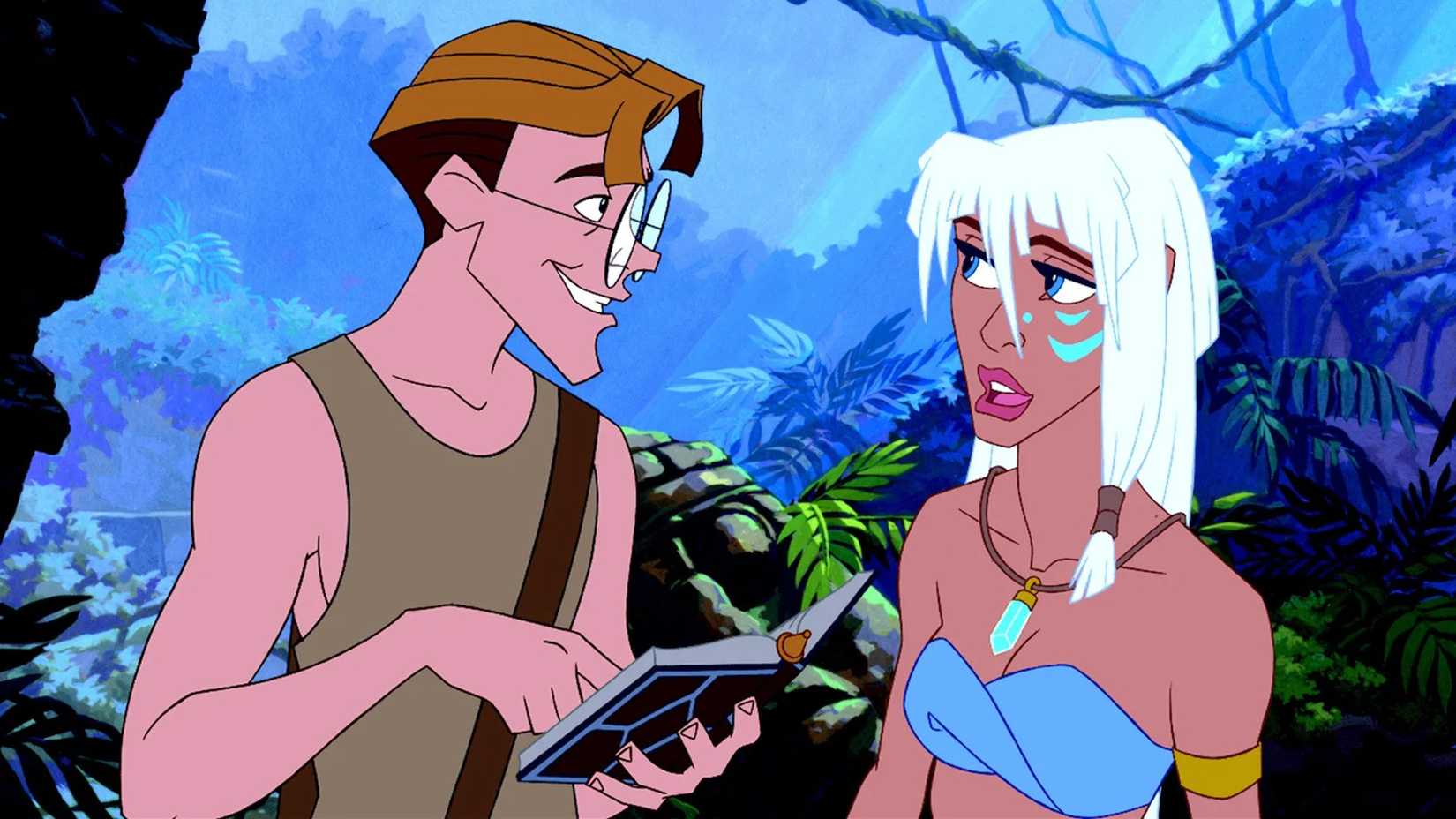 Milo talks to Kida while holding a book in Atlantis the Lost Empire