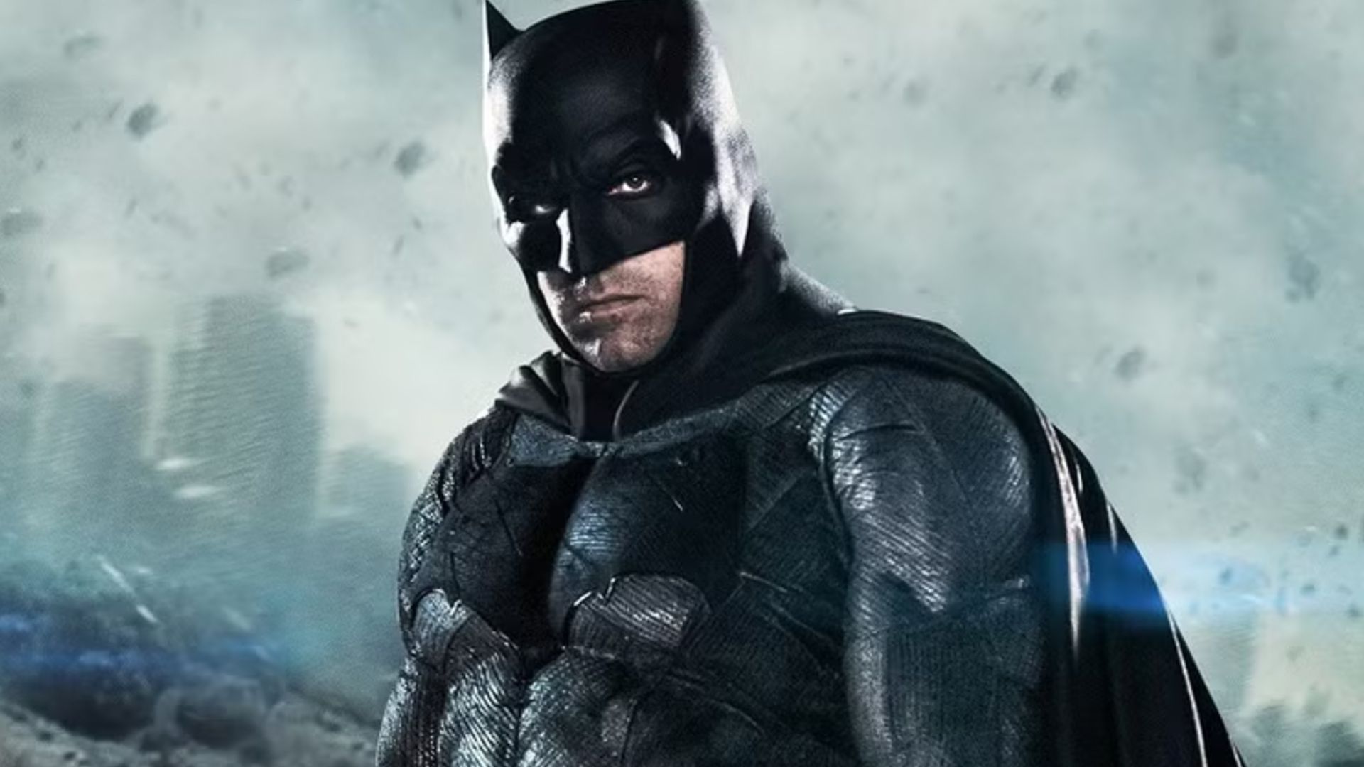 Ben Affleck's Batman standing in front of a ruined city