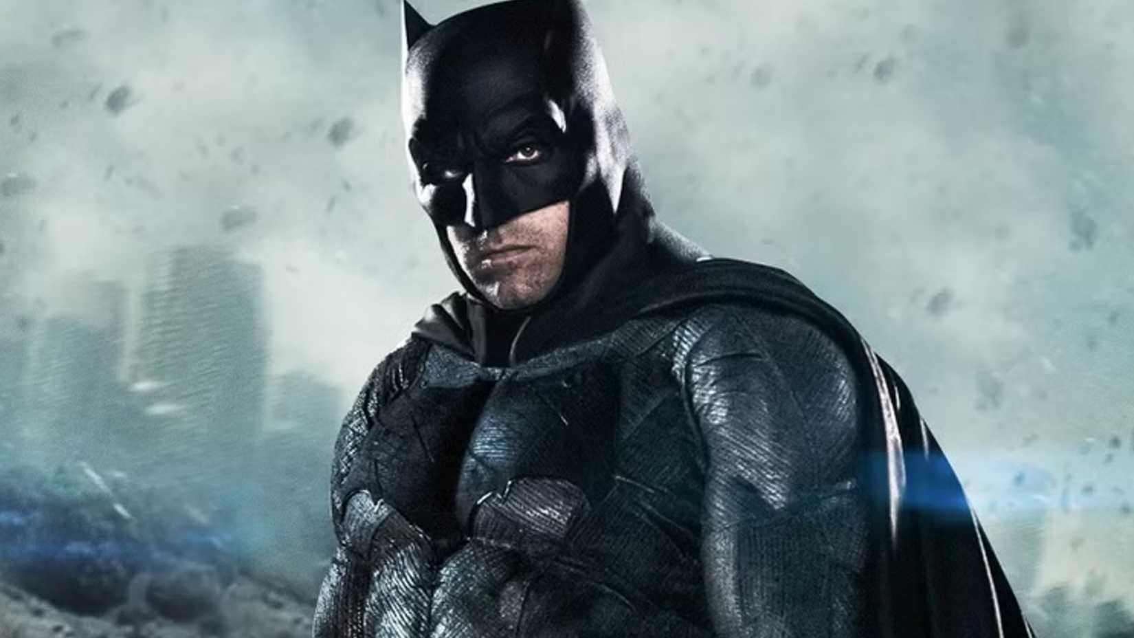 Ben Affleck's Batman standing in front of a ruined city