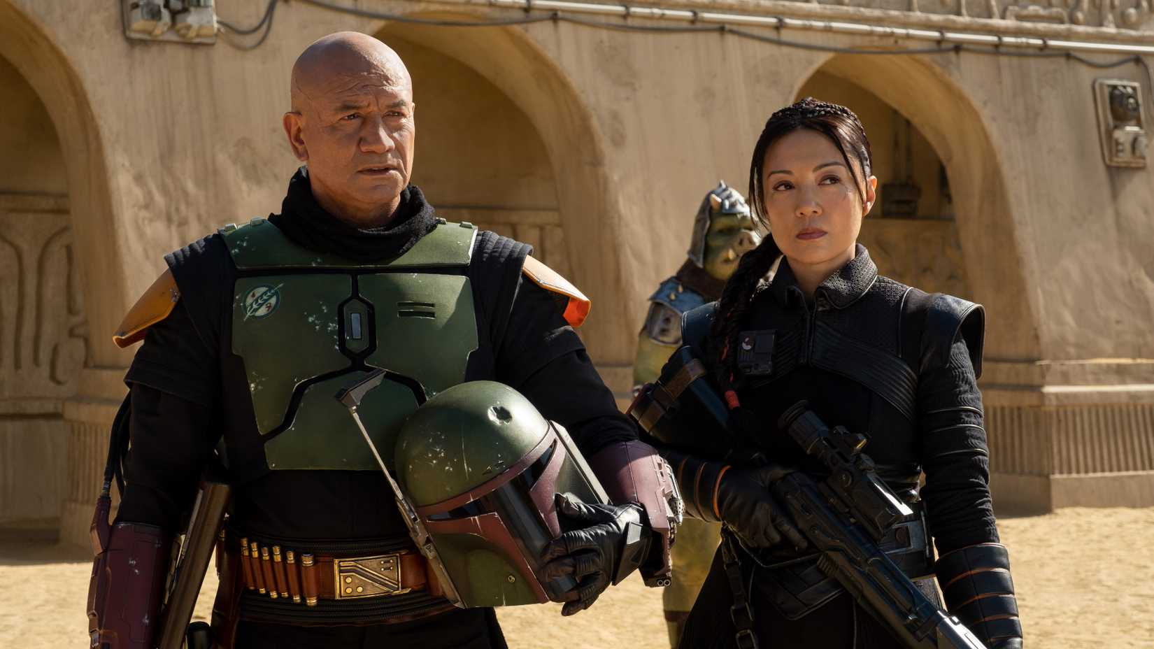 Boba Fett and Ming Na Wen stand next to each other in Star Wars series Book of Boba Fett