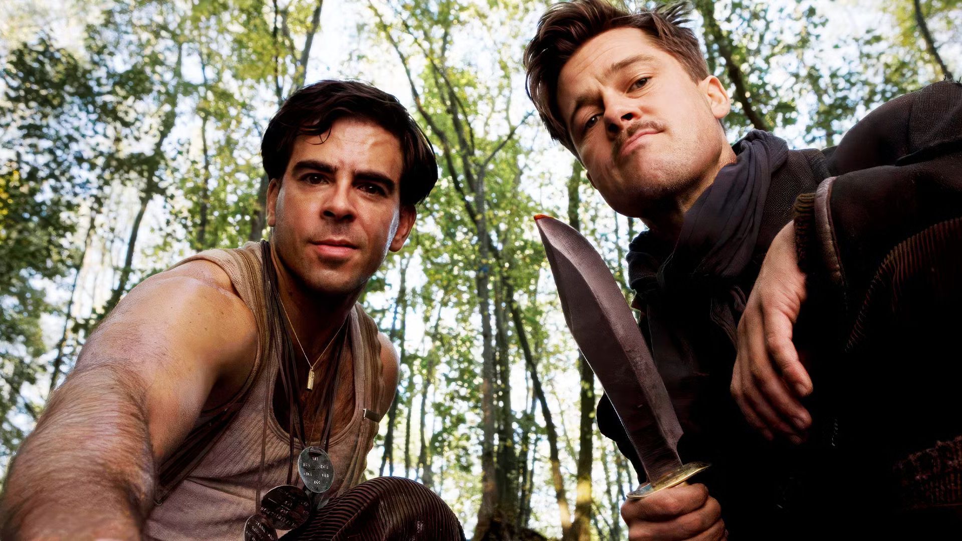 Brad Pitt holding a bowie knife and Eli Roth looking at the camera in Inglourious Basterds
