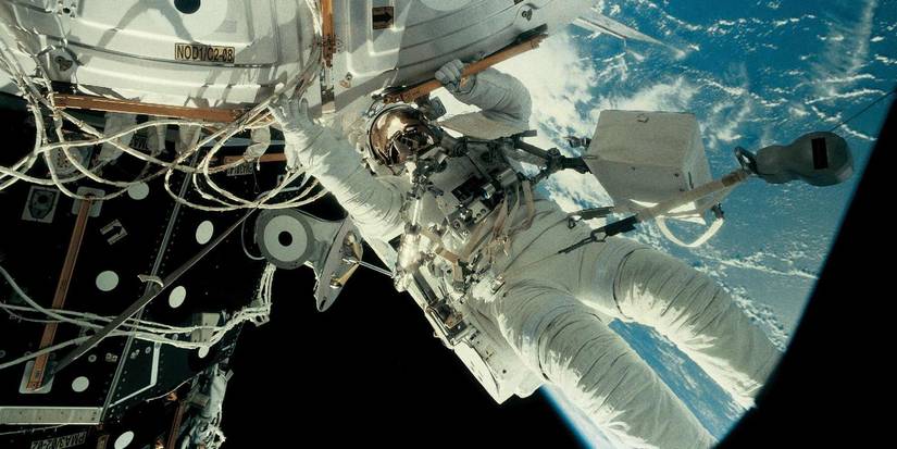 An astronaut floating through space in Space Station 3D.