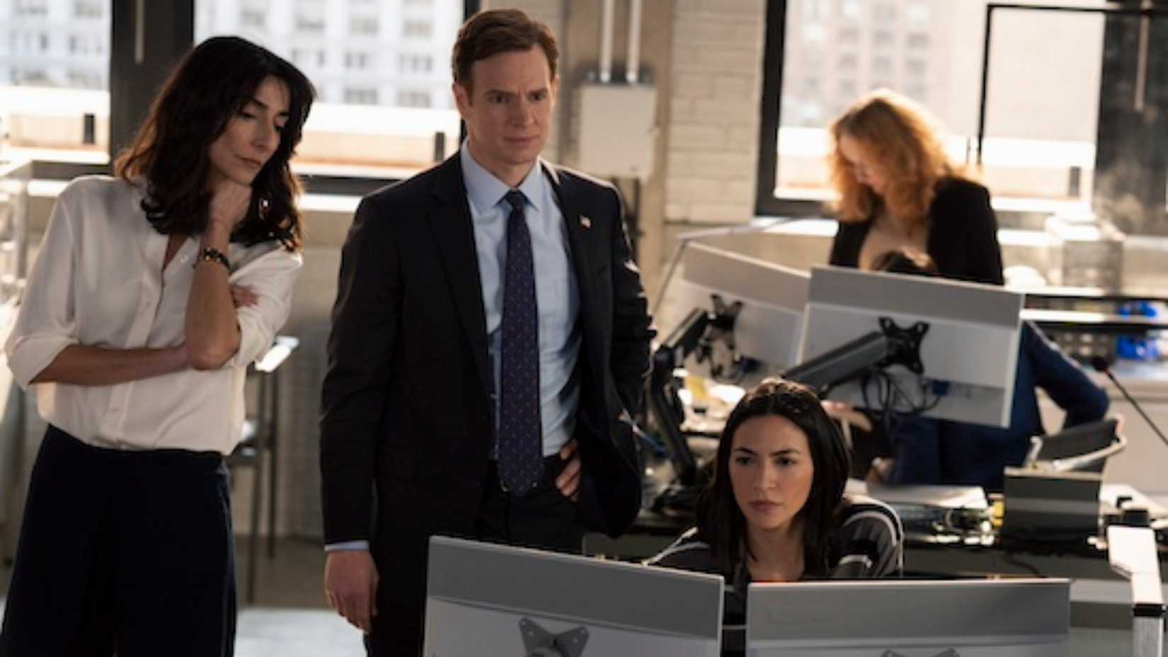 CIA characters looking at a monitor