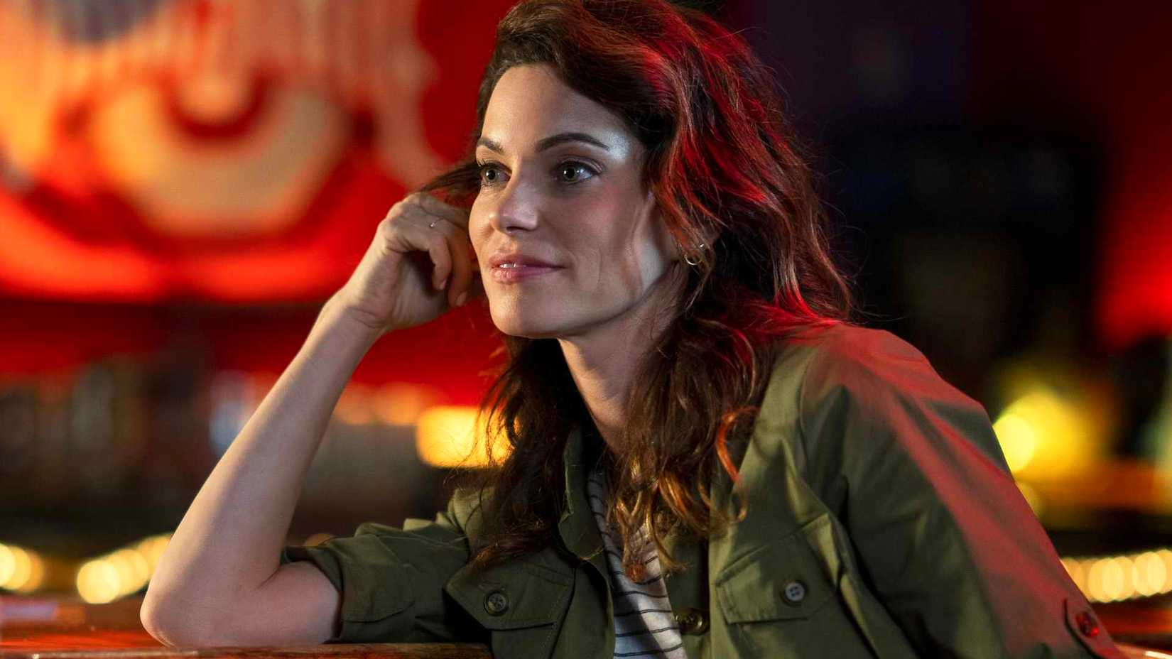 Courtney Henggeler as Amanda LaRusso at a bar in Cobra Kai.