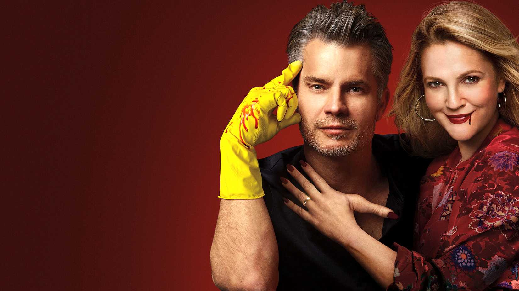 Drew Barrymore and Timothy Oliphant pose with blood on them in Santa Clarita Diet series poster