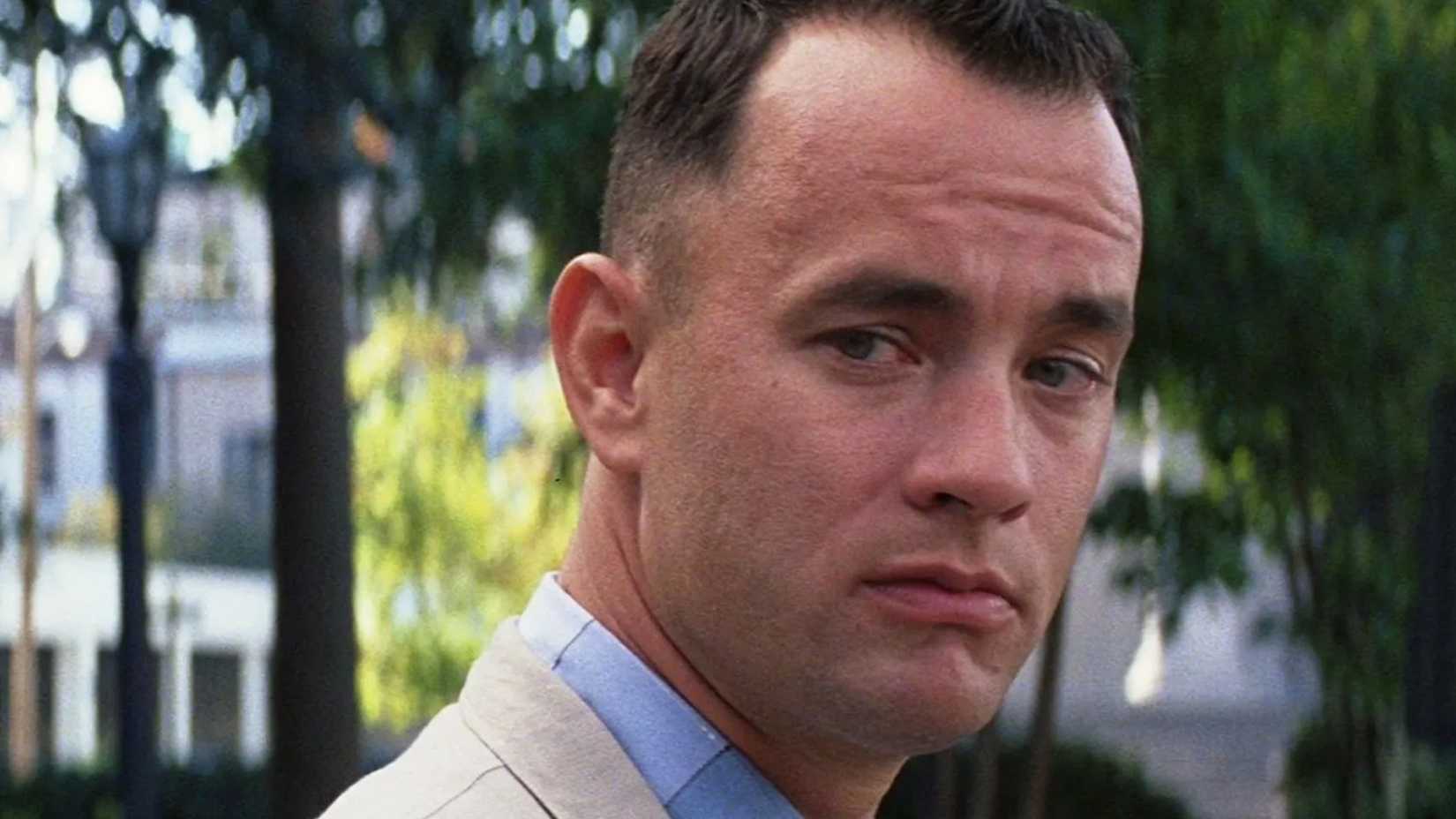 Forrest looks over his shoulder while listening in Forrest Gump