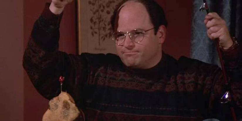 George mit einem Marmorroggen an einer Angelschnur in Seinfeld