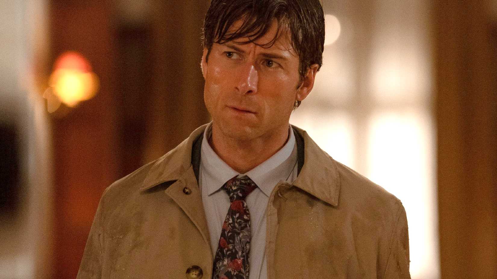 Glen Powell looking wet and disgruntled in How to Make a Killing