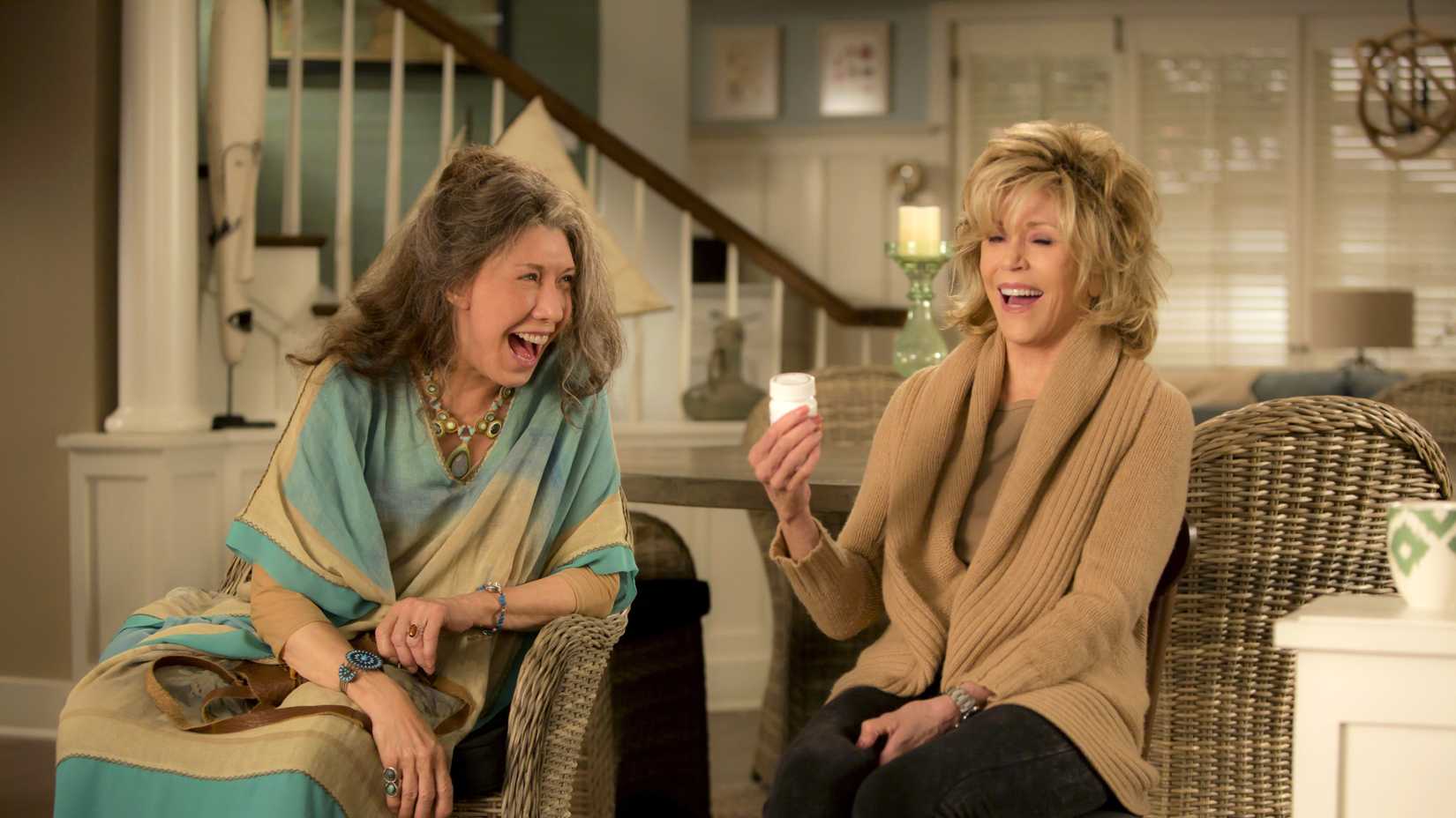 Grace and Frankie laughing in Grace and Frankie