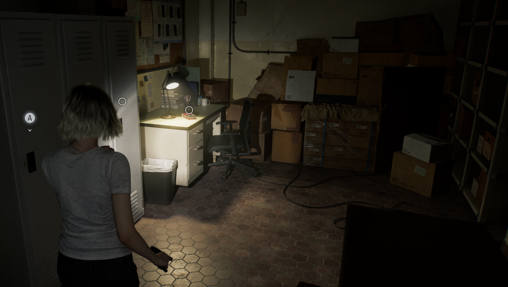 Grace spots ammo on a desk in a small room