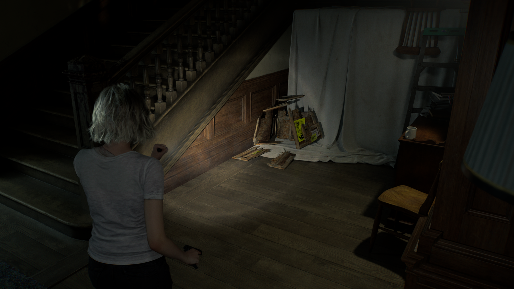 Grace looks at a broken box