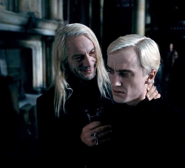 Jason Isaacs as Lucius Malfoy and Tom Felton as Draco Malfoy in Deathly Hallows Part 1