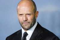 Jason Statham posing on a red carpet
