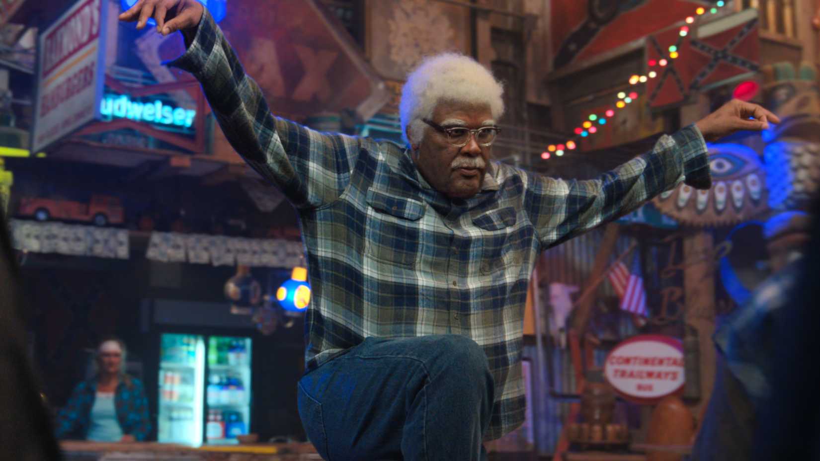 joe in a comedic fight stance in a bar in joe s college road trip