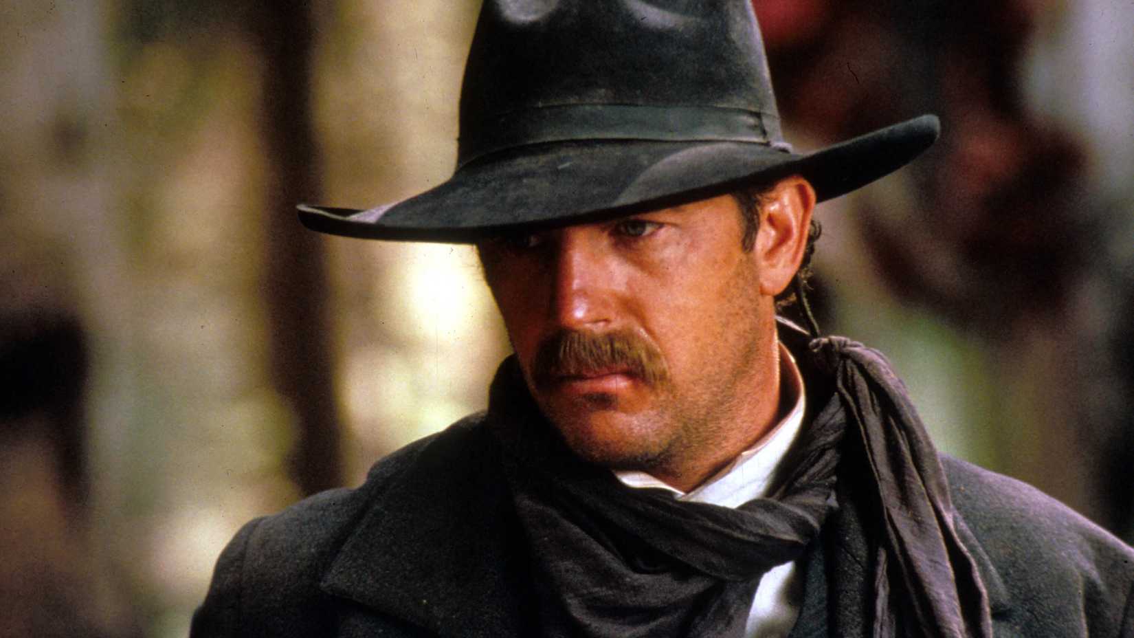 Kevin Costner as Wyatt looking intensely at something in Wyatt Earp