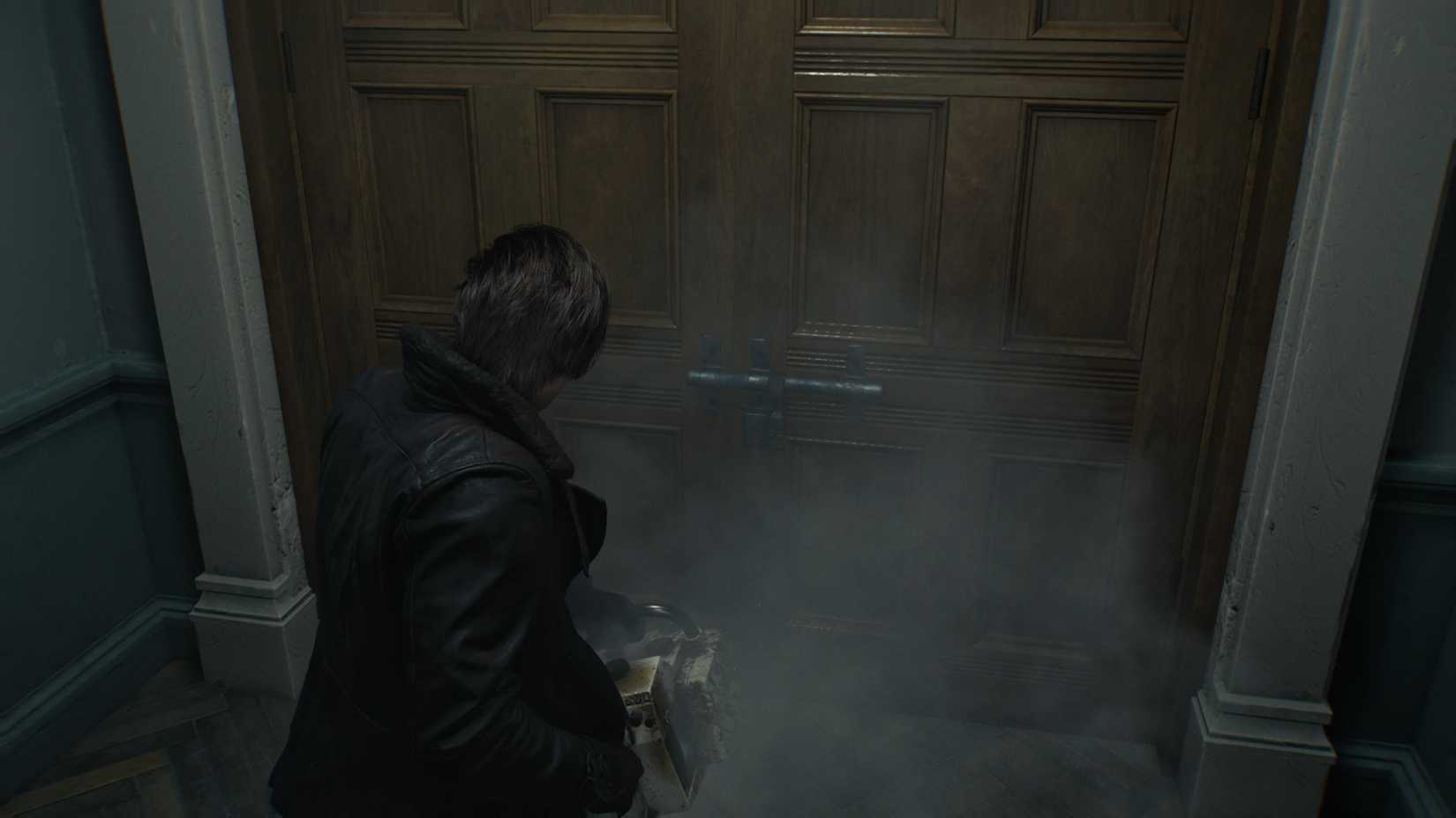 Leon at door with Chainsaw