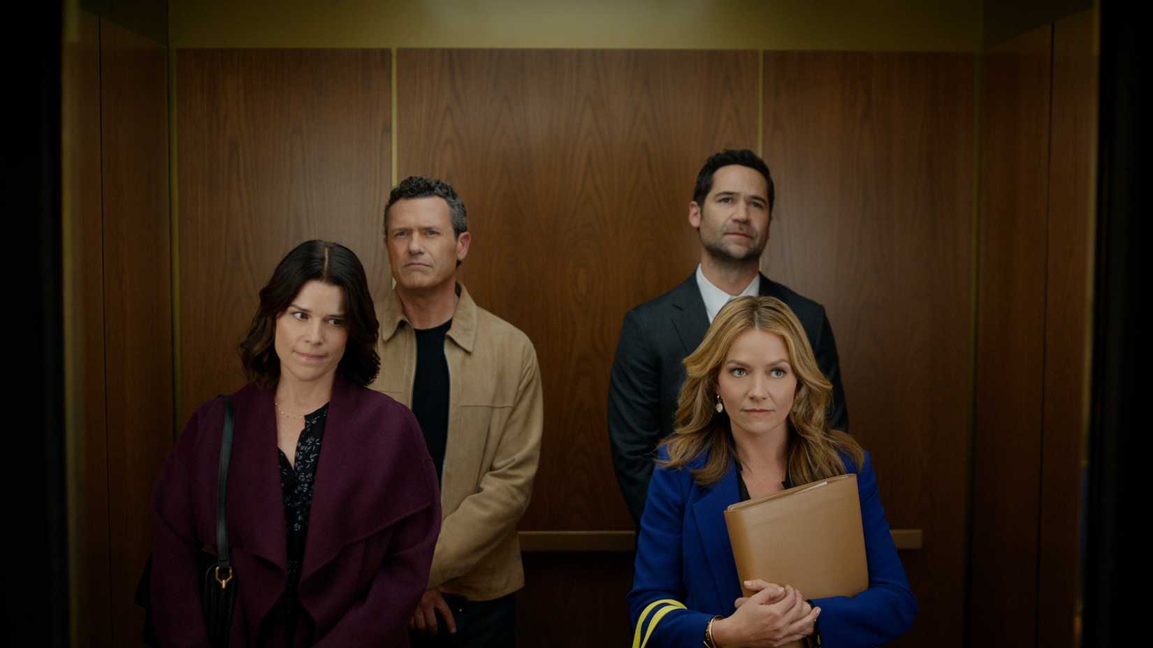 Maggie, Jack, Mickey and Lorna in an elevator in The Lincoln Lawyer season 4