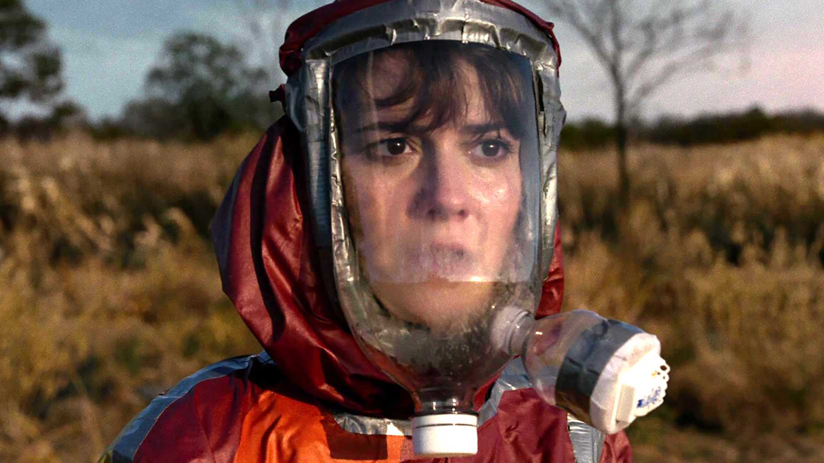Mary Elizabeth Winstead's Michelle looking worried while outside in her DIY radiation suit in 10 Cloverfield Lane
