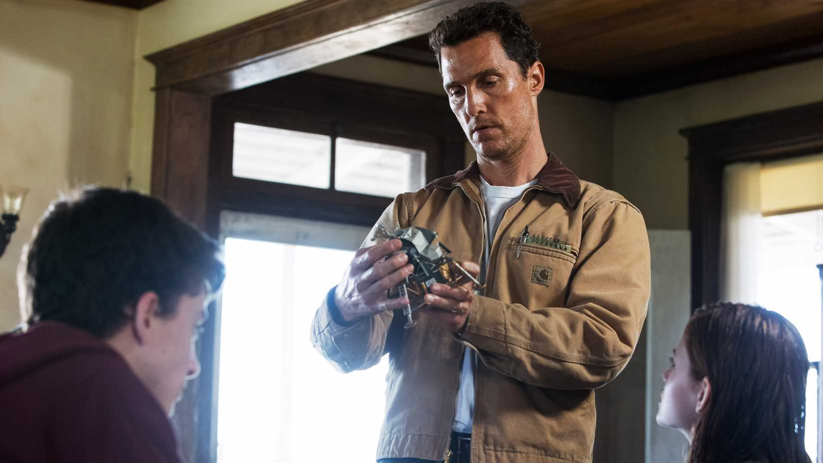 Matthew McConaughey inspects a device in Interstellar