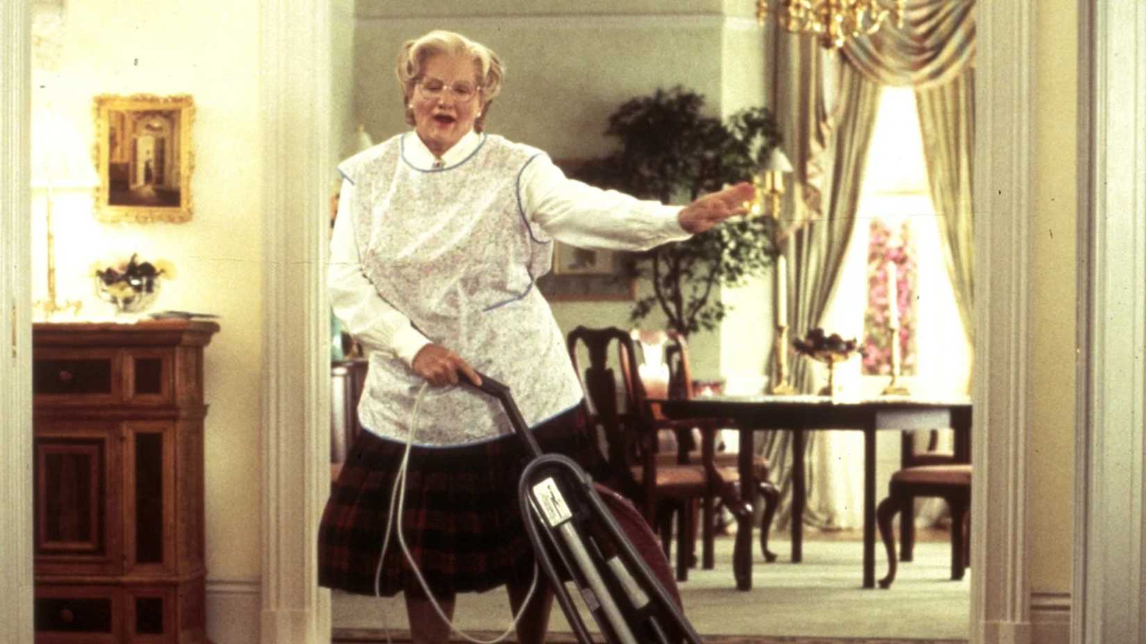Mrs. Doubtfire dances with a vacuum in Mrs. Doubtfire