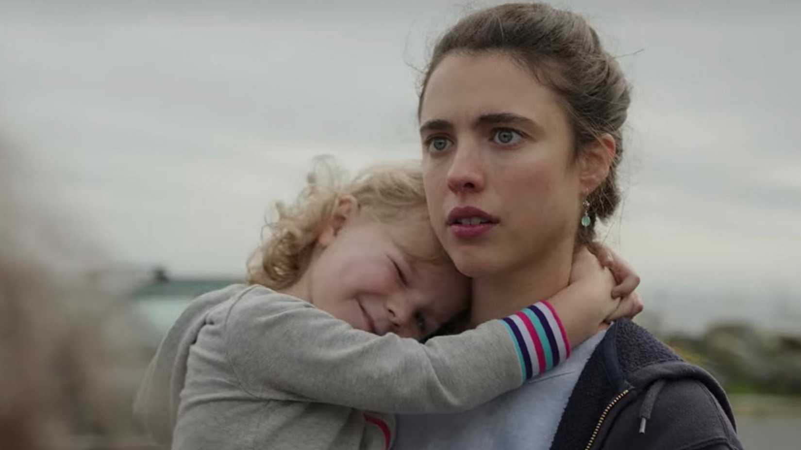 Margaret Qualley holding a child in Netflix's Maid.
