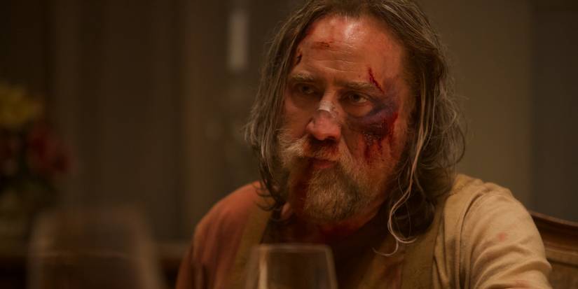 nicolas cage covered in blood in pig