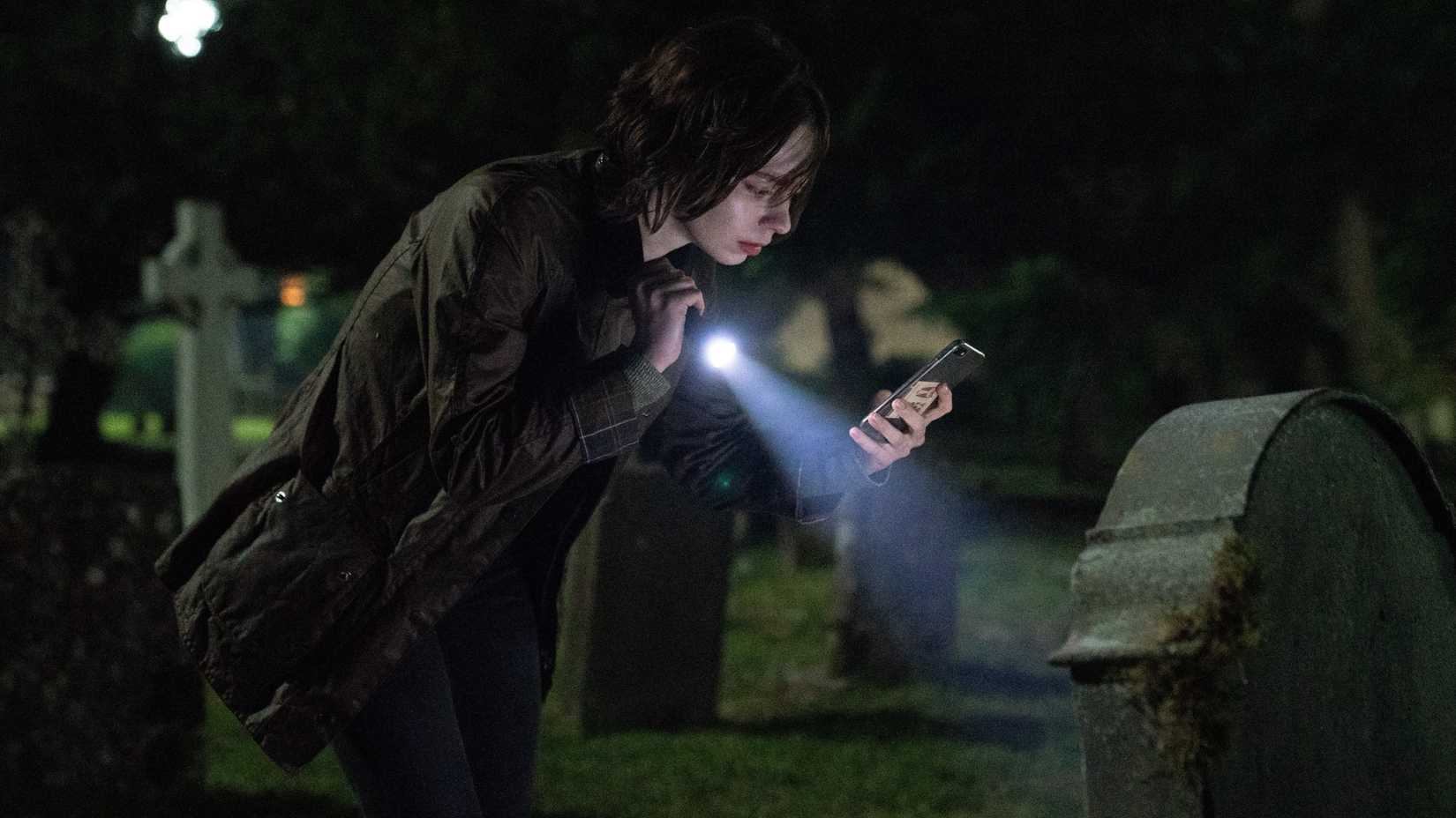 pip with a flaslight in a graveyard in a good girl s guide to murder seaso n2