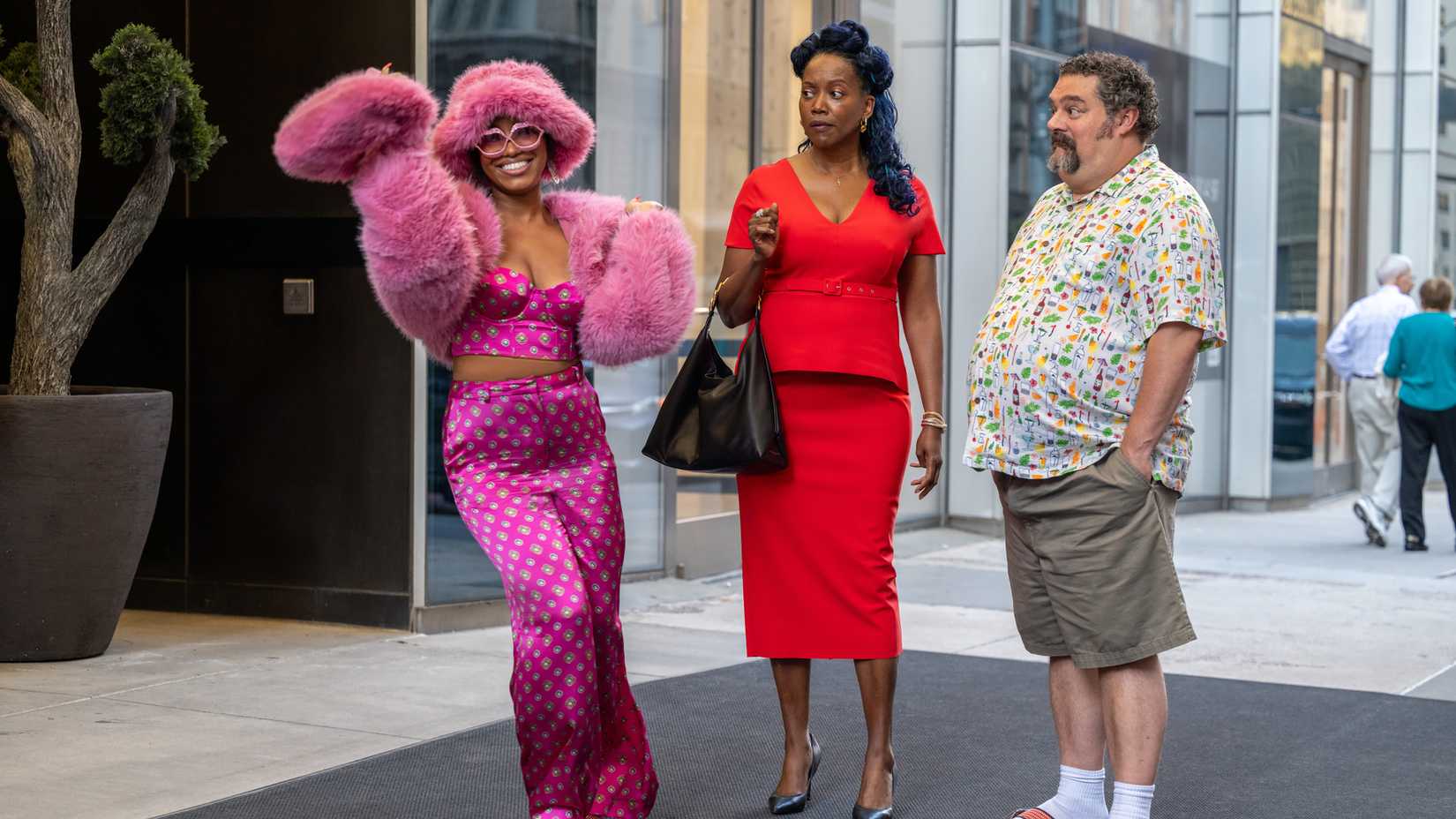 precious way as brina erika alexander as monica bobby moynihan as rusty boyd standing in a lobby in the fall and rise of reggie dinkins