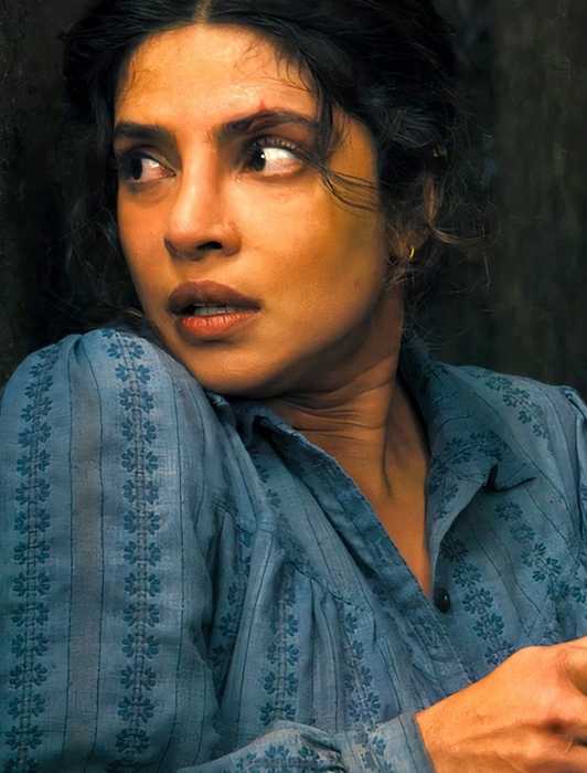 Priyanka Chopra Jonas hiding behind a tree to reload in The Bluff