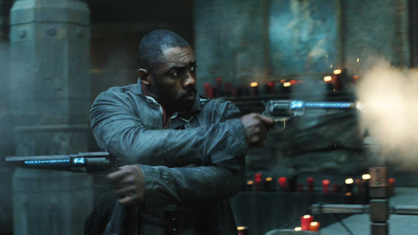 Roland (Idris Elba) shooting two guns at once in The Dark Tower