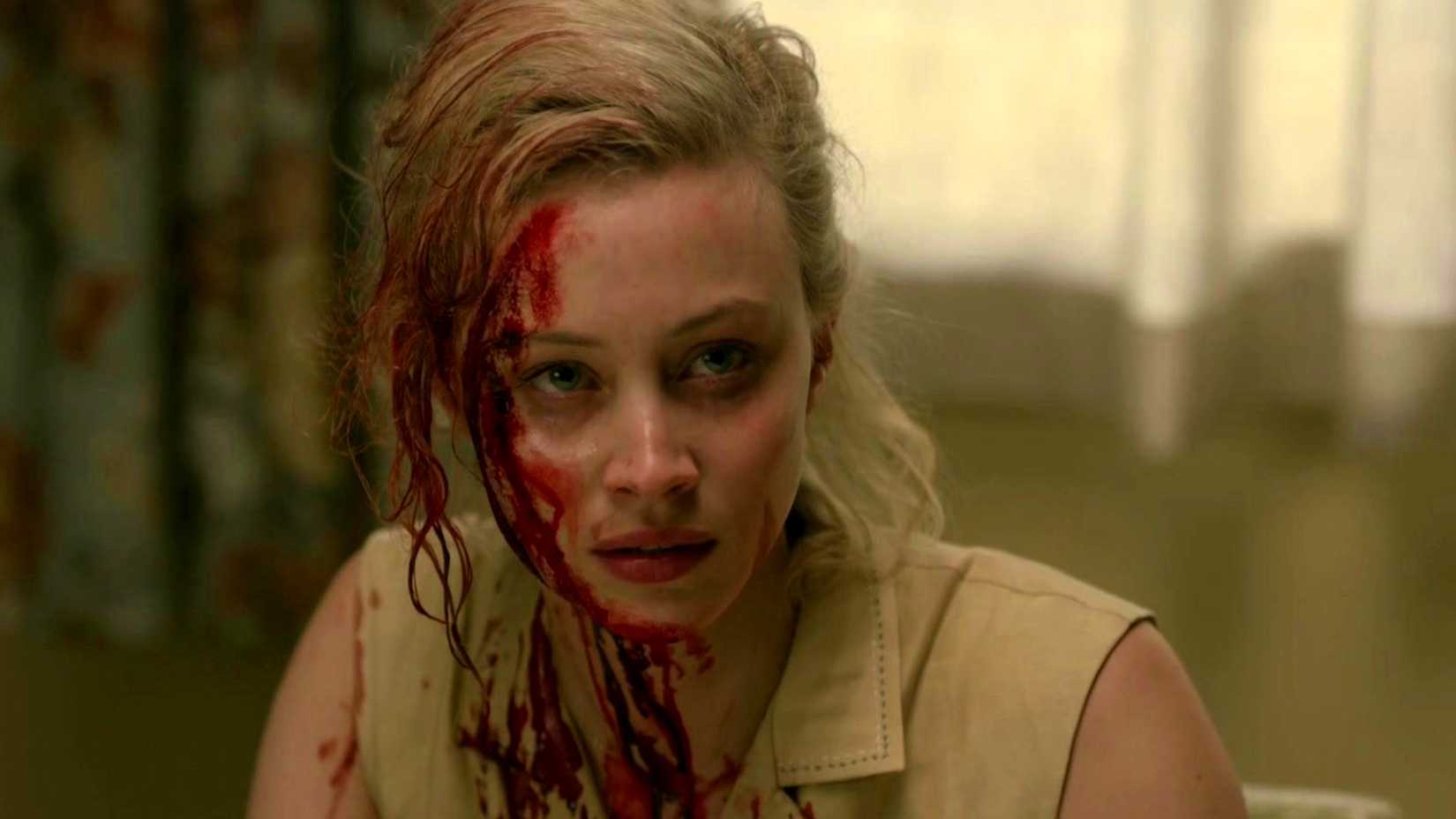 Sarah Gadon with half of her face covered in blood in 11.22.63