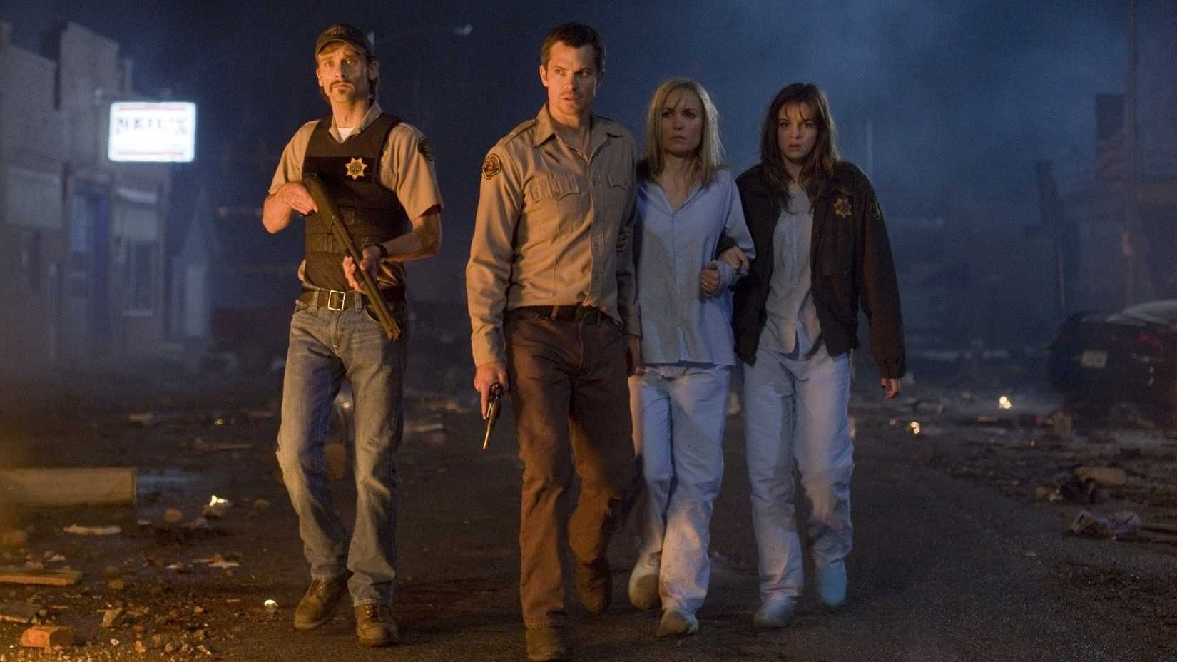 The survivors walk down the street with guns in The Crazies