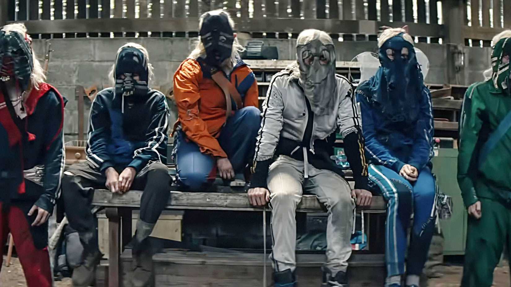 The Fingers in a line wearing their masks in 28 Years Later The Bone Temple