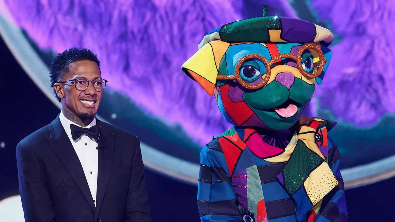 The Masked Singer Season 14 Contestant Pugcasso & Host Nick Cannon On Stage
