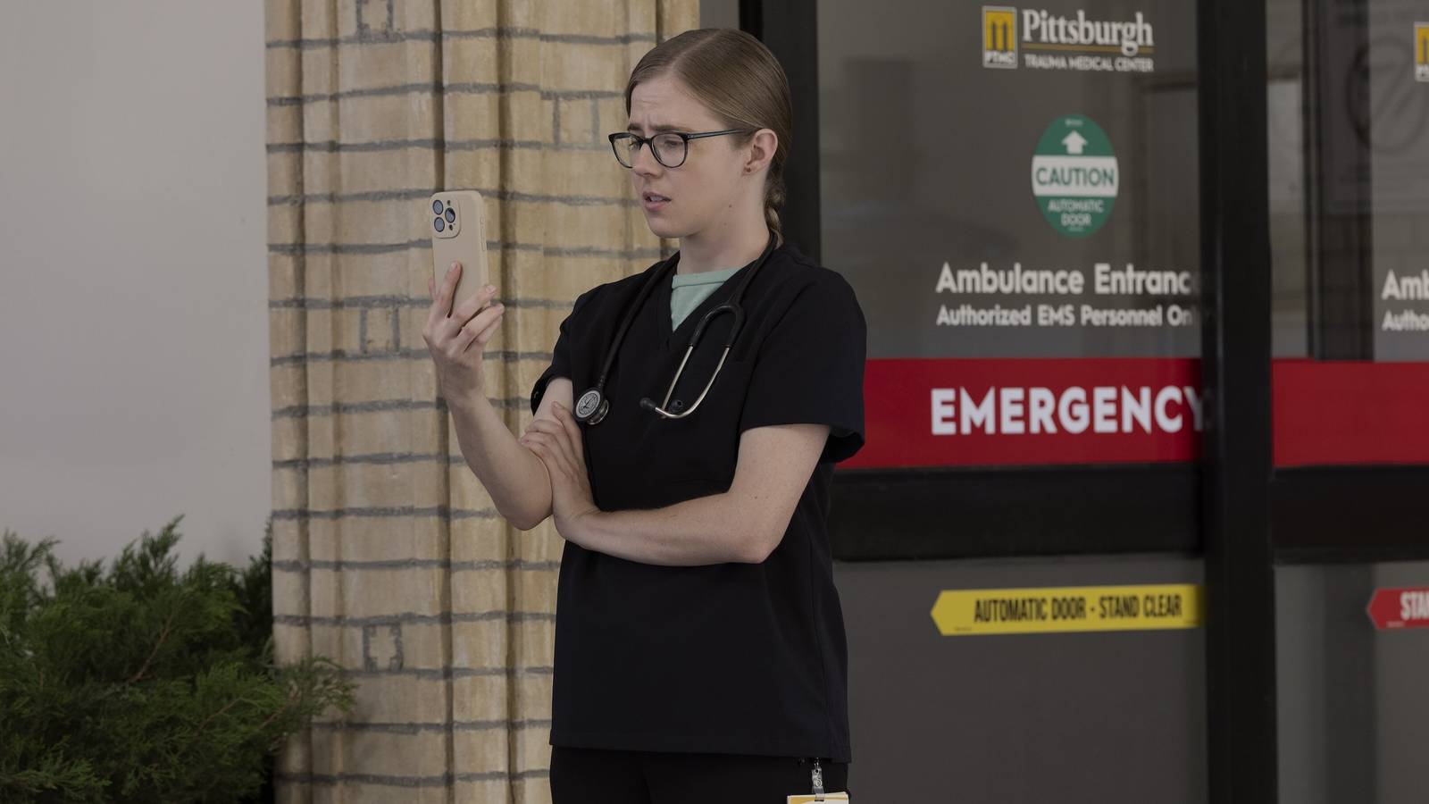 Dr. Mel King (Taylor Dearden) on the phone in The Pitt season 2, episode 7