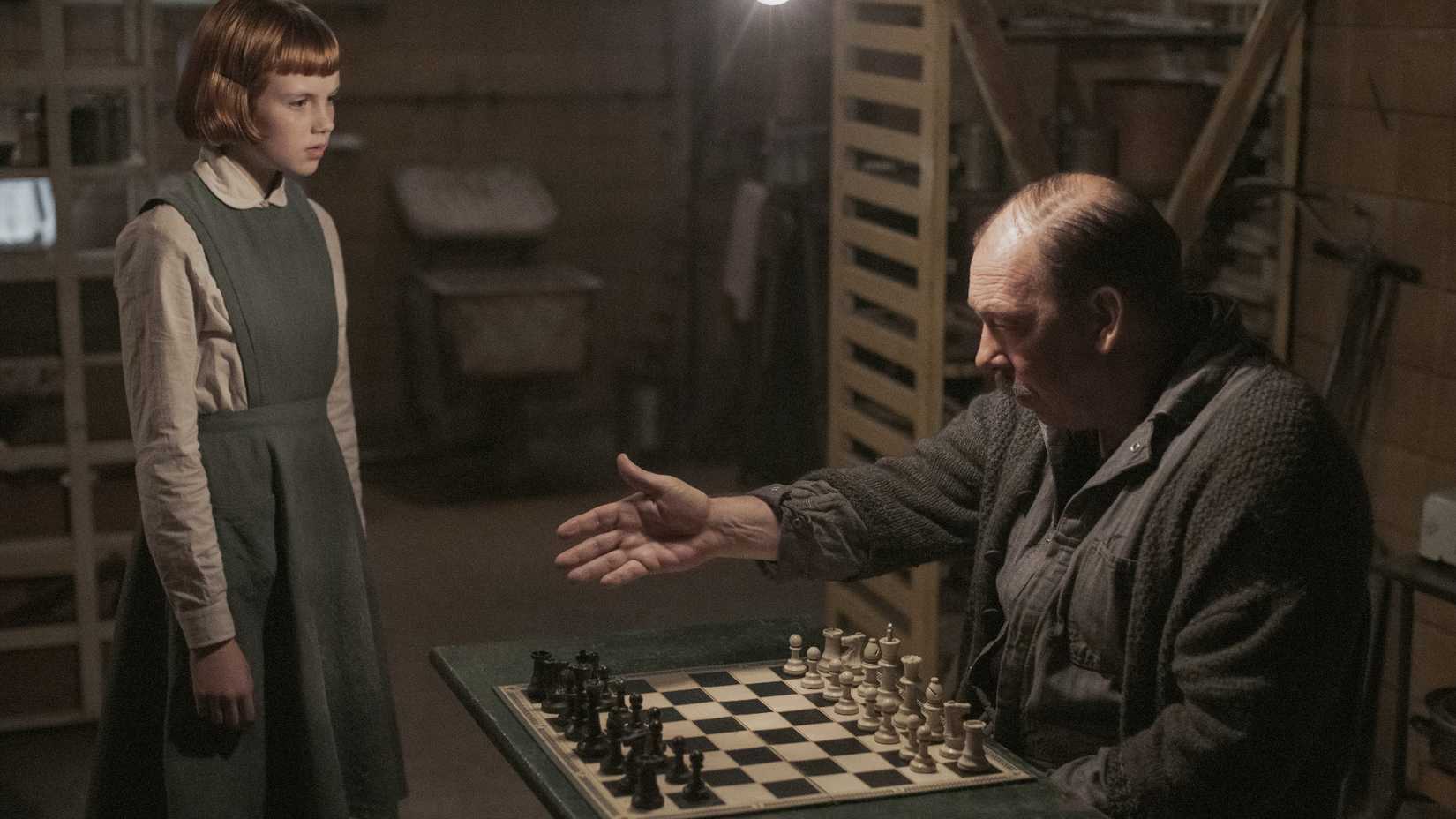 A Young Beth Learning to Play Chess in The Queen's Gambit 