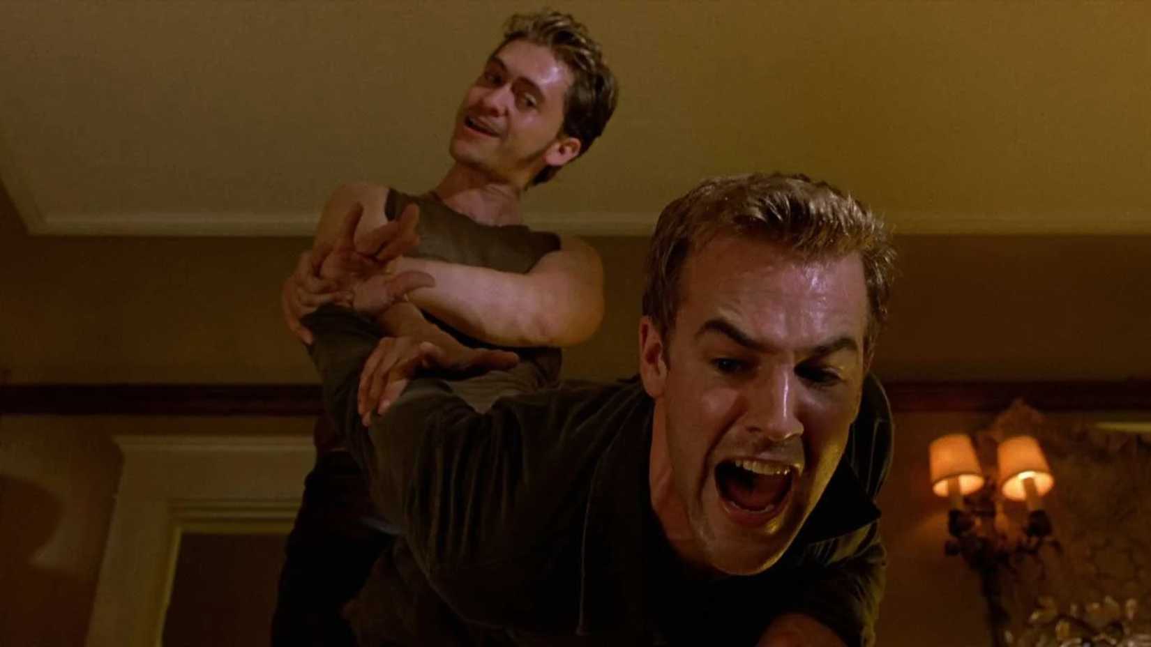James Van Der Beek screams as he's put in an arm hold in The Rules of Attraction
