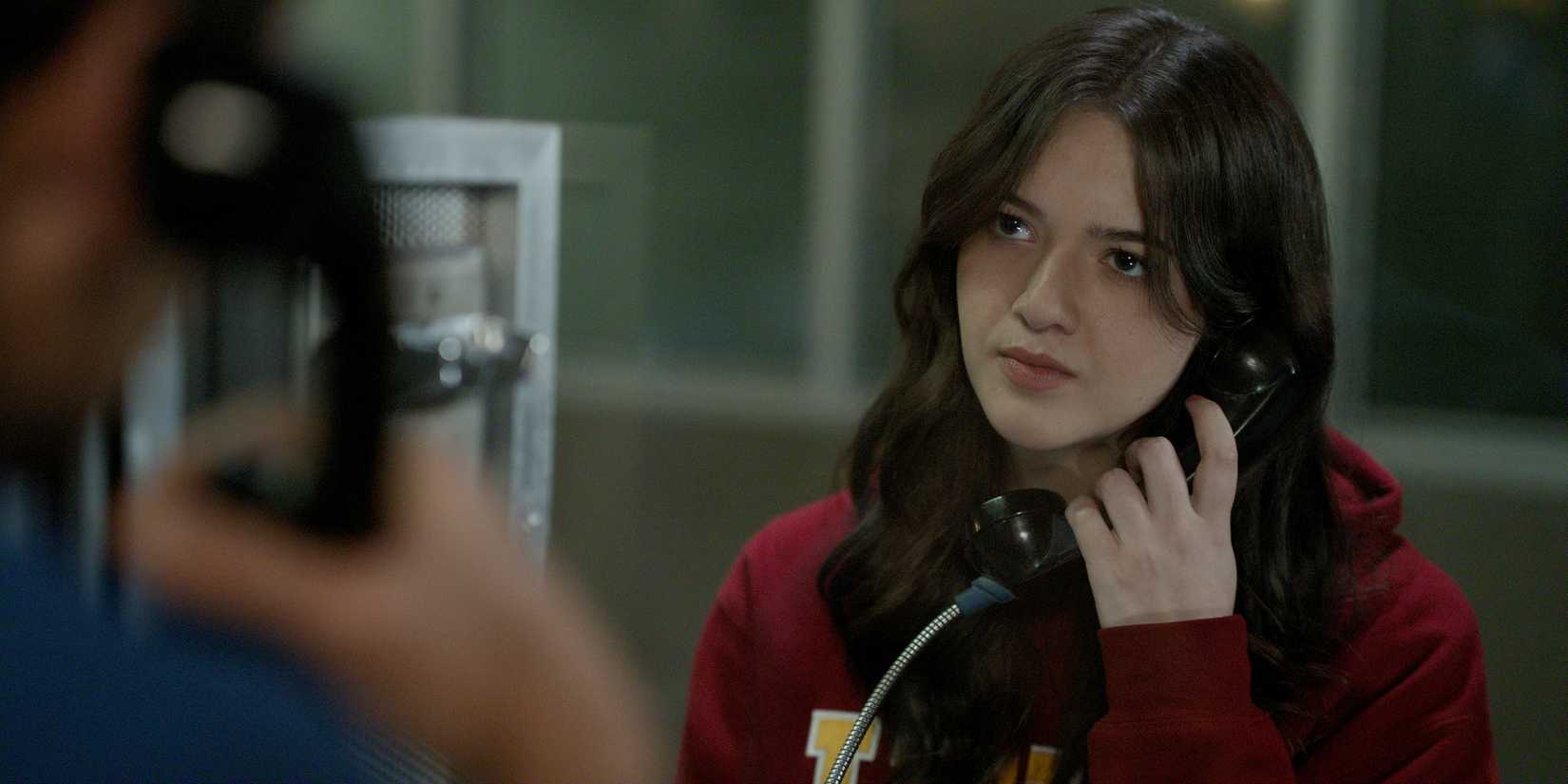 Hayley Haller is on the phone with her dad at the prison in The Lincoln Lawyer season 4.