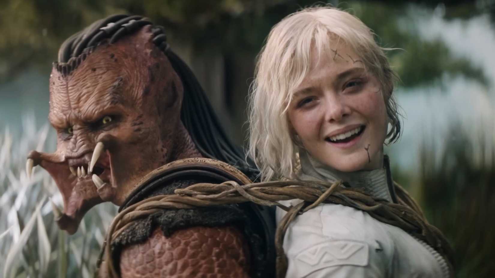 Thia smiling while the Predator is screaming in Predator Badlands