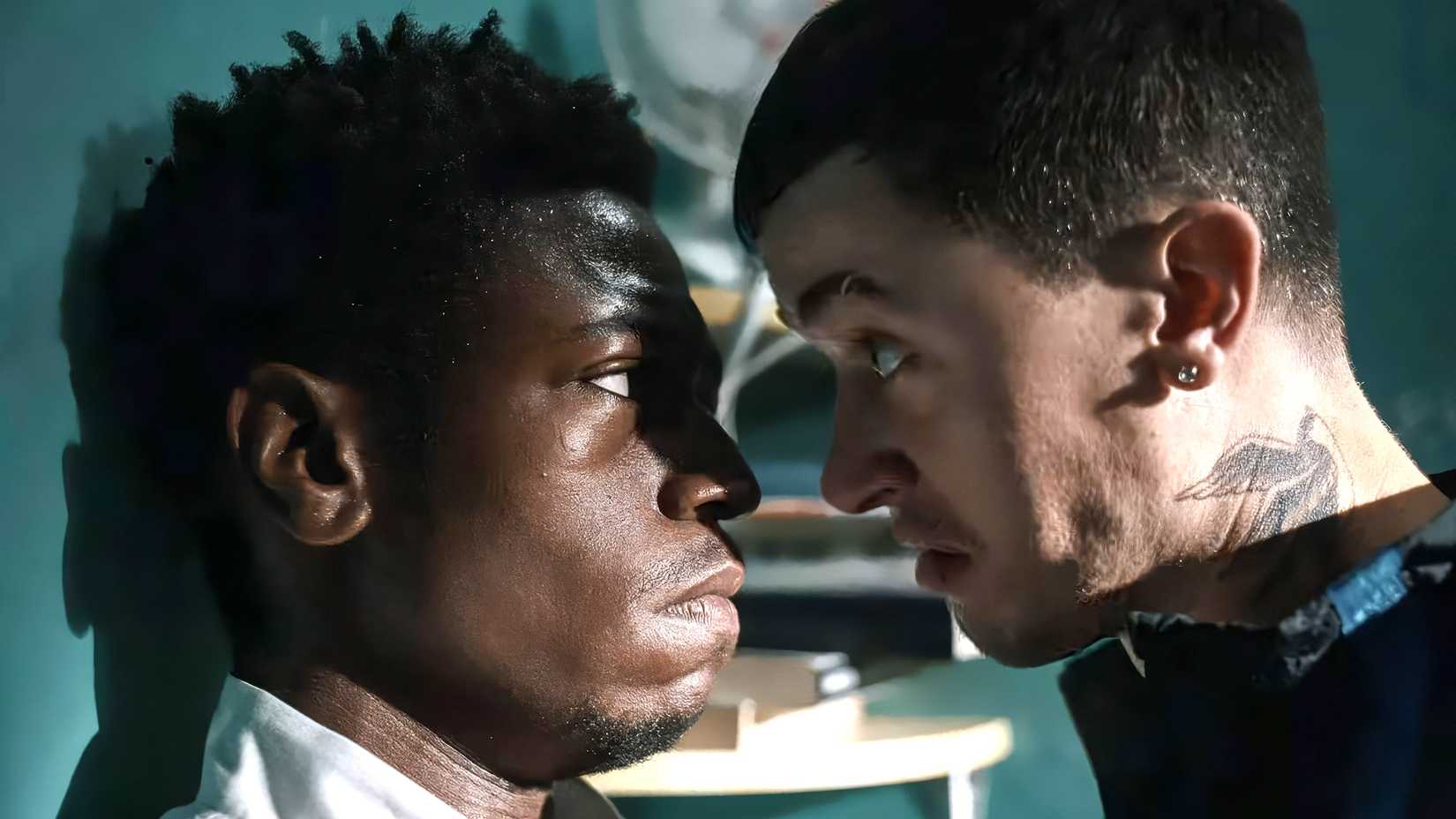 Tom Blyth's Dee getting in the face of David Jonsson's Taylor against a wall in Wasteman