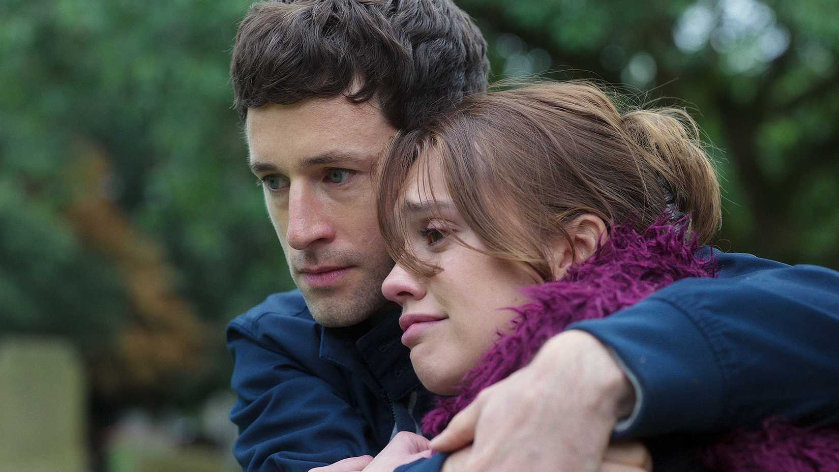 A young man and a young woman hugging in Toxic Town on Netflix