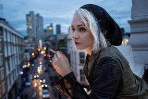Tuppence Middleton leaning on a balcony in Sense8